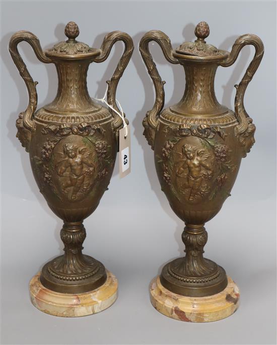 A pair of gilt spelter urns